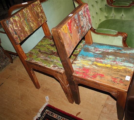 A pair of distressed chairs